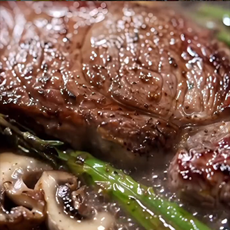Easy pan-seared NY strip steak with mushrooms and asparagus